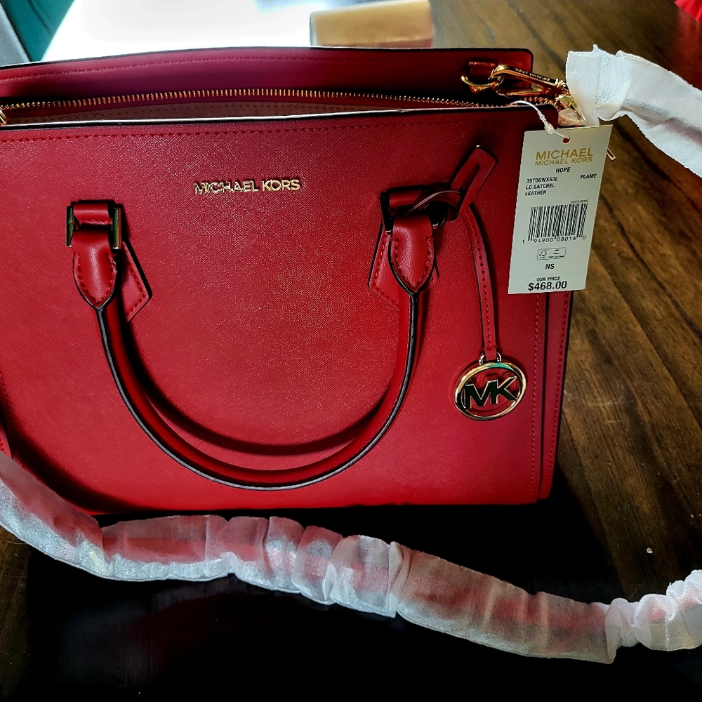 Michael Korls leather shoulder bag.